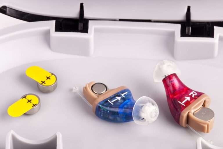 Inner ear hearing aids, left and right in carrying case with batteries