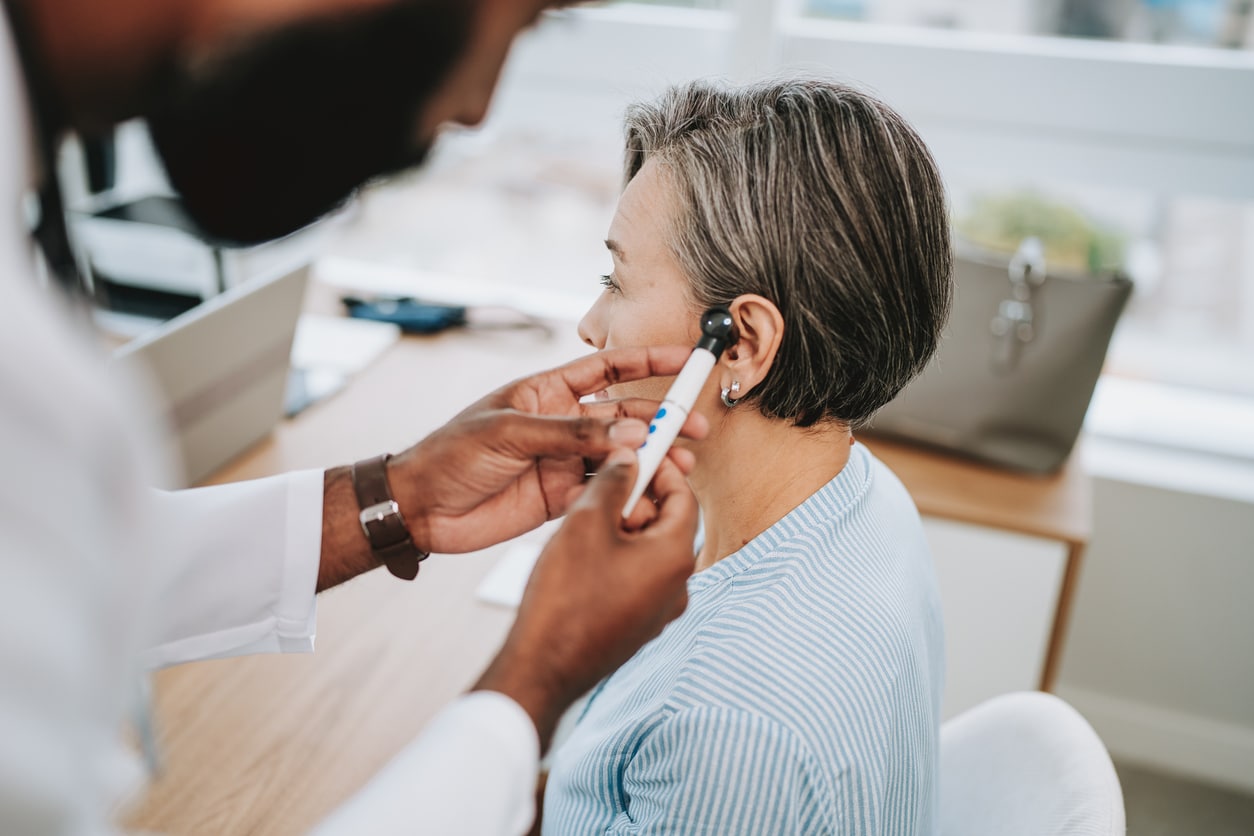 Doctor examining a patient's ear